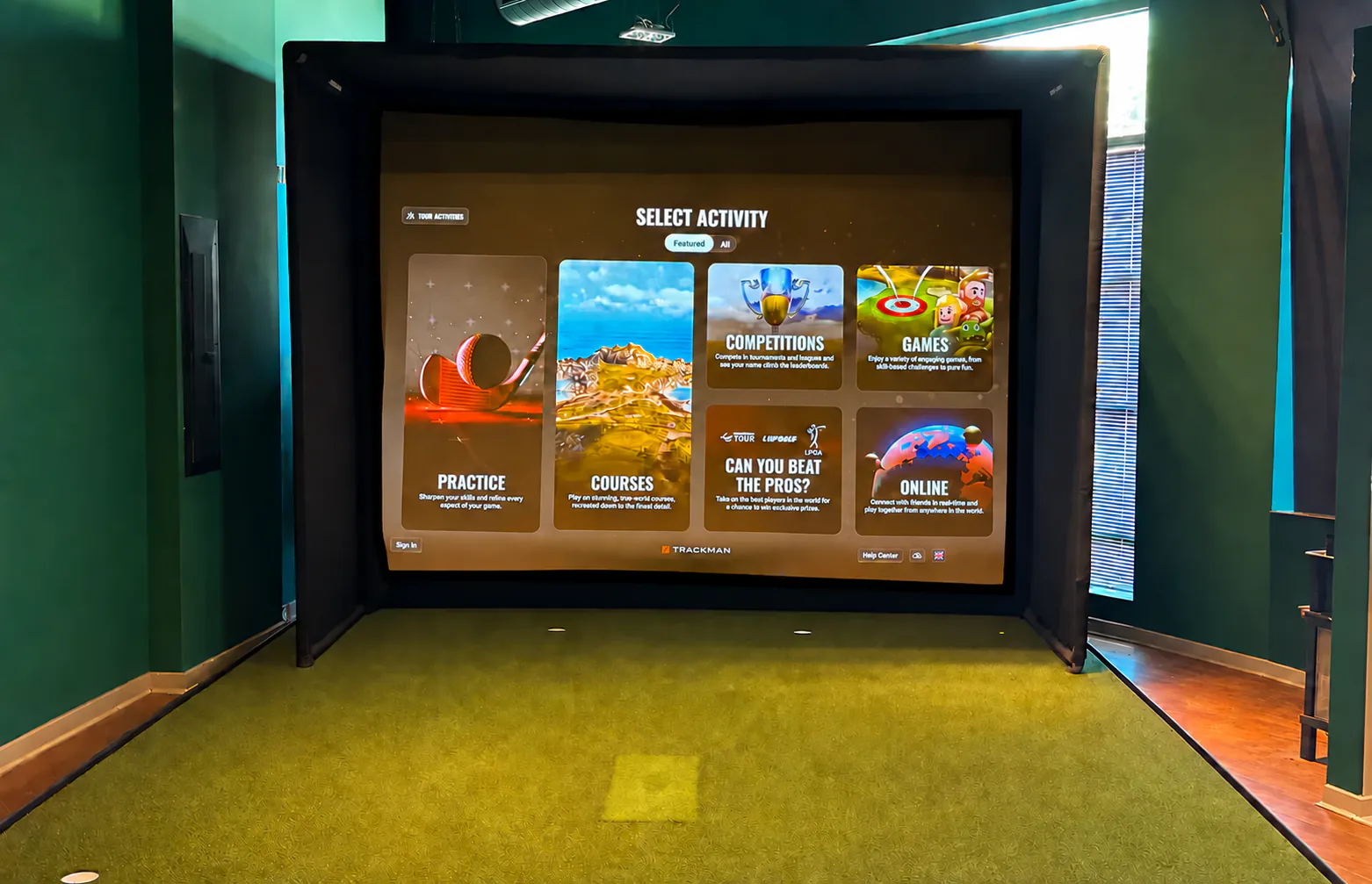 Bay 1 - Entry Room with Trackman simulator and projection screen